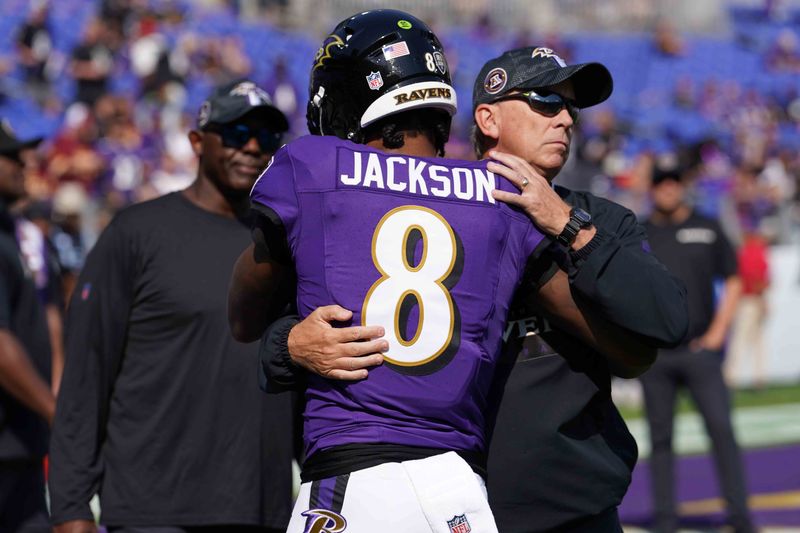Oct 13, 2024; Baltimore, Maryland, USA; Baltimore Ravens quarterback Lamar Jackson (8) greets offensive coordinator Todd Monken prior to the game against the Washington Commanders at M&T Bank Stadium. Mandatory Credit: Mitch Stringer-Imagn Images
