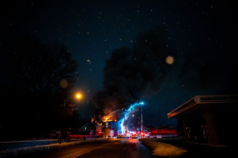 Akron Fire Department firefighters battle a blaze at the condemned Parkside Apartments Building, Feb. 3, 2026, at 1341 S. Main St. in Akron, Ohio.