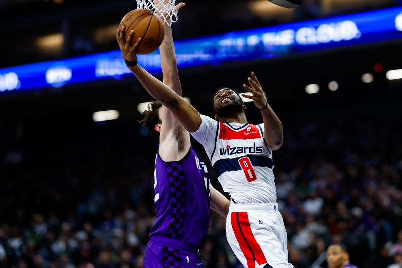 Wizards guard Malaki Branham drives to the basket as Kings center Maxime Raynaud (42) defends on Jan. 16.
