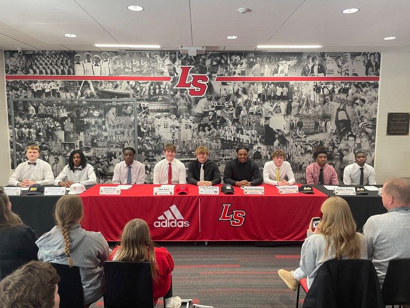 Several La Salle Lancer football players signed their letters of intent to play college sports Feb. 4, 2026. From left are: Justin Lynch, Mount St. Joseph baseball; Taron Lester, Walsh University football; David Itodo, Walsh University football; Max Kief, Miami University football; Colin Wooldridge, Ohio University football and wrestling; Dereion Spraggs, Ohio Dominican football; Caleb Troehler, Ohio Dominican football; Rodney Portis, Ohio Dominican football; Claude Moore, Ohio Dominican football. Not pictured is Hunter Ogdan, who signed with West Point in December.