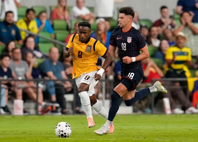 Ecuador forward John Yeboah (9) works against United States midfielder Max Arfsten (18) on Oct. 10.