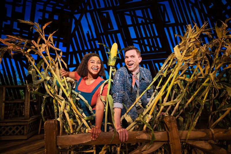 Maya Lagerstam (Left) and Joe Moeller play the storytellers, characters that lead us through the zaniness of “Shucked,” opening a two-week run at the Aronoff Center on Feb. 10.