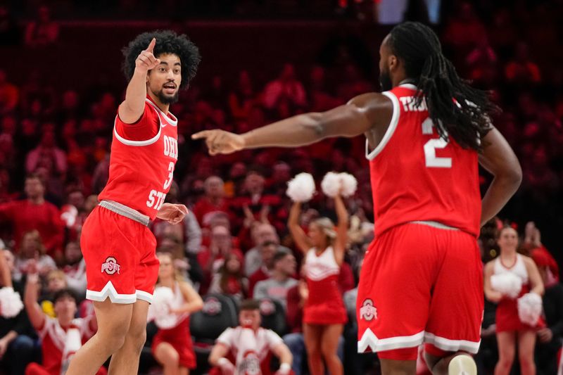 Ohio State Buckeyes guard Taison Chatman (3) celebrates a three pointer with guard Bruce Thornton (2) during the first half of the NCAA men's basketball game against the Michigan Wolverines at the Schottenstein Center in Columbus on Feb. 8, 2026.