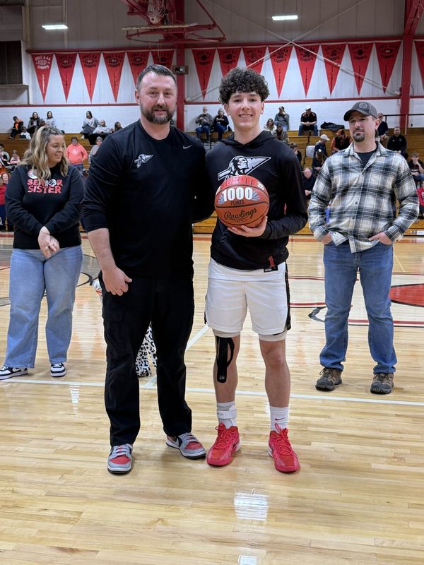Caldwell senior Dylan Schott stands with head coach Clint Crane after reaching the 1,000 career points milestone with a 24 point night during Friday's home game with New Lexington. Schott was tabbed with Division VI First Team All-Ohio honors with the release of the Ohio Prep Sports Writers Association All-Ohio team on Wednesday, March 25, 2026.