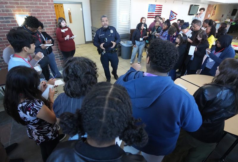 During a mock-crime scene scenario, Columbus Police Officer Wendell J. Tolber answers questions during the Columbus Journalists in Training seminar on Saturday, Feb. 7, 2026. The multi-week reporting program is sponsored by The Columbus Dispatch, Columbus City Schools, Central Ohio Society of Professional Journalists, Columbus Association of Black Journalists and Denison University. Photos by Isabel Escobar, Tyler Clodfelter, Izaiah Cooper-Neff, Emily Amador, Sandra Fu, Patrick Flaherty, and Doral Chenoweth.