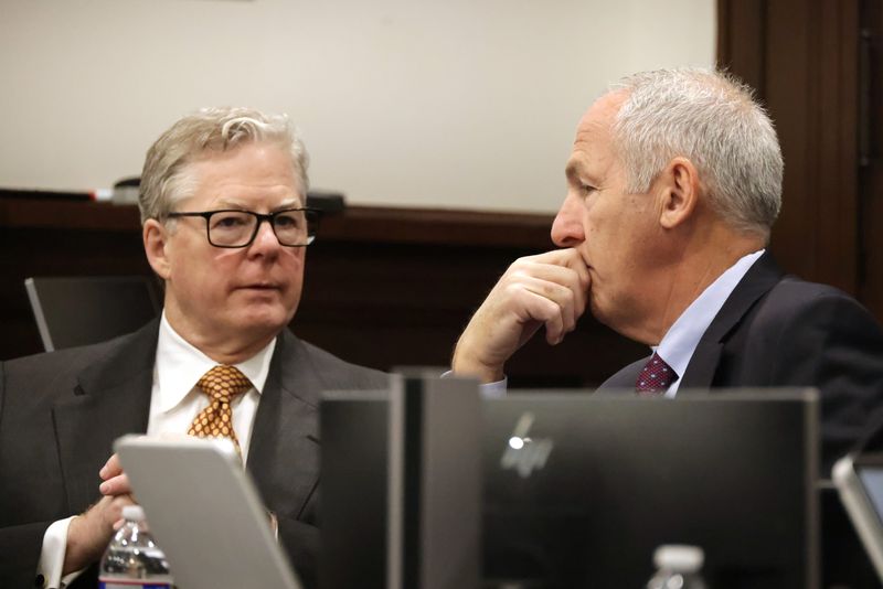 Former FirstEnergy Senior Vice President Michael Dowling, right, speaks with his attorney, John McCaffrey, during the trial of Dowling and ex-FirstEnergy CEO Chuck Jones on Feb. 9 at the Summit County Courthouse.