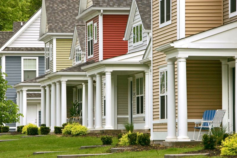 Photo of front porches on homes on E. North St. in the Cascade Village development taken on Saturday, May 16, 2009, in Akron, Ohio. The front porch is making a comeback and is becoming prominent in the home designs in the area. (Ed Suba Jr./Akron Beacon Journal)