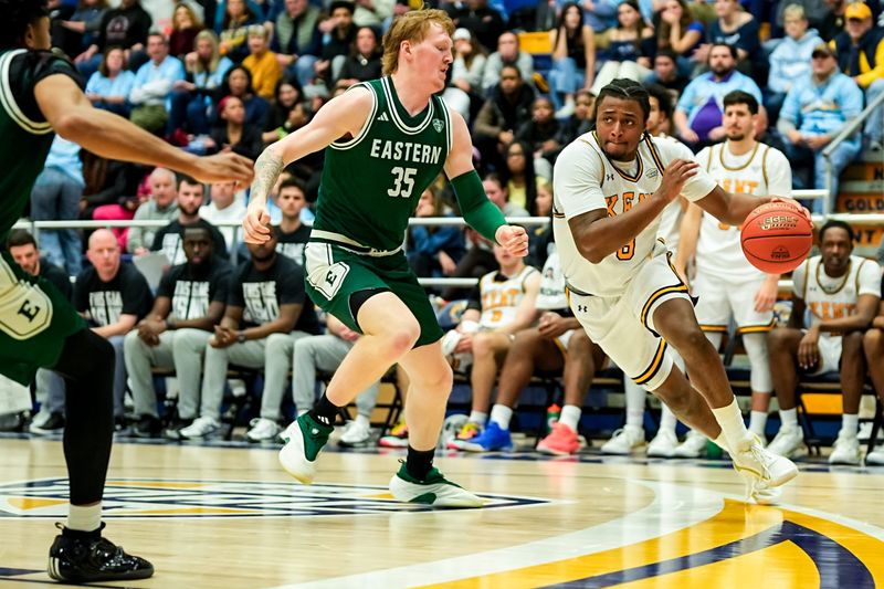 Kent State University’s Morgan Safford (8) drives to the basket as Eastern Michigan University’s Merritt Alderink (35) guards, Feb. 11, 2026, at M.A.C. Center in Kent, Ohio.