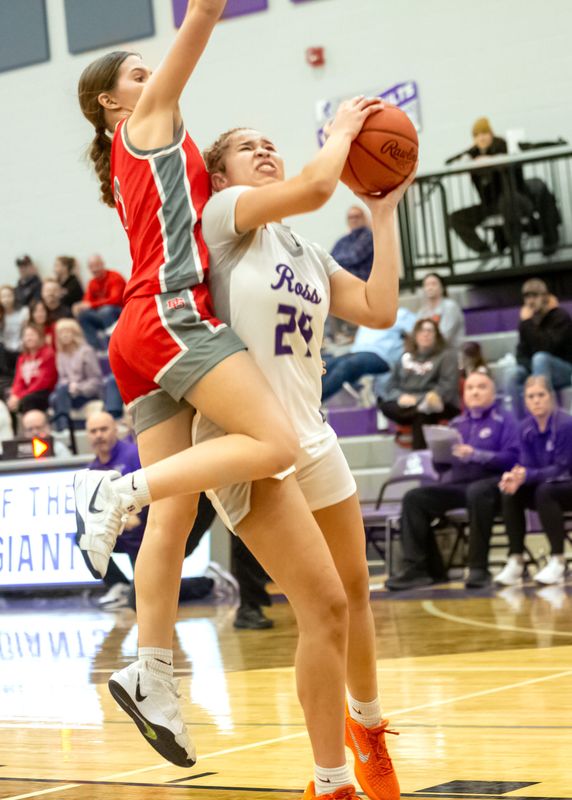 Ross' Brynn Ward looks to score.