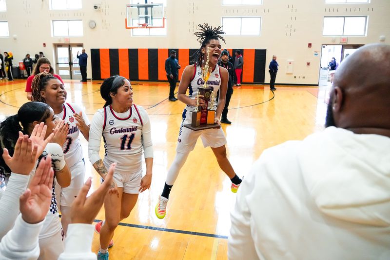 Centennial's Kennedy Houston (2) celebrates after a 49-47 win over Africentric in the City League final Feb. 14 at East.