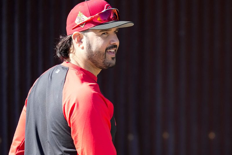 Cincinnati Reds infielder Eugenio Suarez worksout with the team during Spring Training in Goodyear, Ariz. Major League ballplayers like Suarez, who is from Venezuela, fear for their game, their own families, and even at times their own safety.
