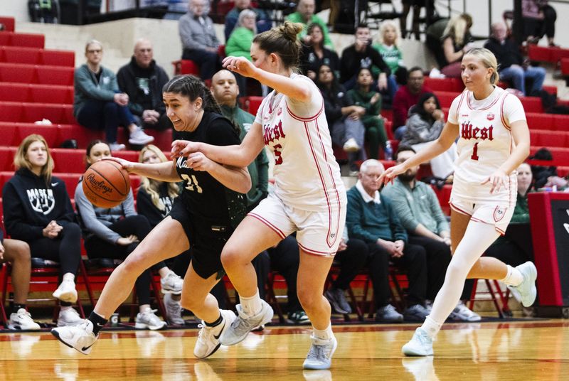 Anna Habra (31) of the Mason Comets dribbles the ball toward the paint in the third quarter during a game between Lakota West and Mason, Saturday, Feb. 14, 2025, at Lakota West High School.