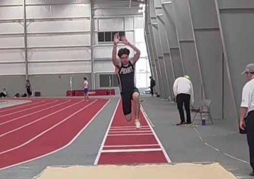 Perry's Evan Laubacher competes in the triple jump during the Stark County Indoor Track and Field Championships on Sunday, Feb. 15.