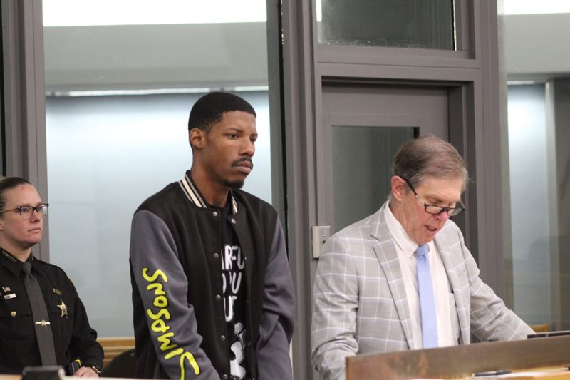 De'Angelo Robinson, 28, appears in court with his attorney, Derek Gustafson, right, for an arraignment in Hamilton County Municipal Court on Feb. 16, 2026.