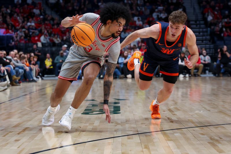Feb 14, 2026; Nashville, Tennessee, USA; Ohio State Buckeyes guard Taison Chatman (3) dribbles the ball past Virginia Cavaliers guard Dallin Hall (30) during the first half at Bridgestone Arena. Mandatory Credit: Steve Roberts-Imagn Images