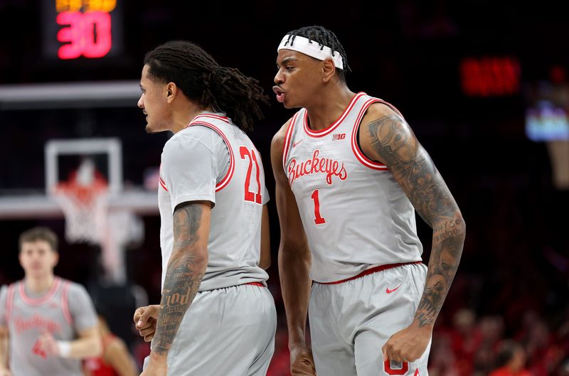 Feb 17, 2026; Columbus, Ohio, USA; Ohio State Buckeyes forward Amare Bynum (1) congratulates forward Devin Royal (21) during the first half against the Wisconsin Badgers at Value City Arena. Mandatory Credit: Joseph Maiorana-Imagn Images