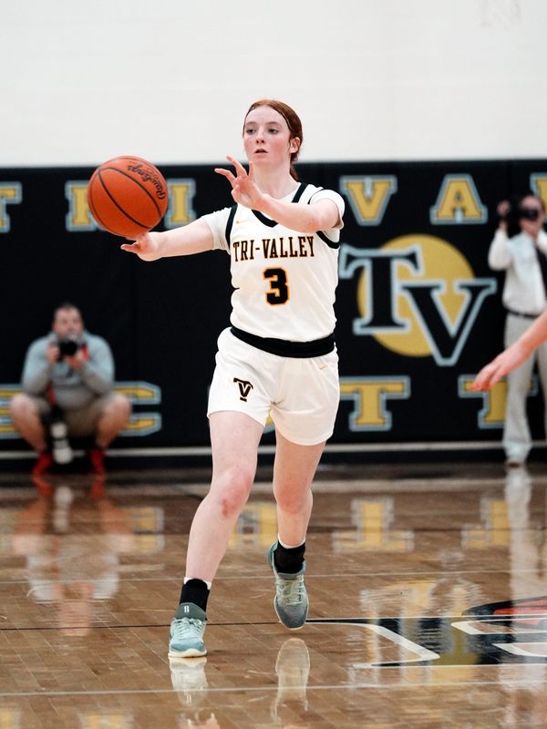 Maddie Garber passes the ball up court during Tri-Valley's 44-22 win against visiting New Philadelphia in a Division III East District tournament game on Wednesday, Feb. 18, 2026, in Dresden. Garber scored seven of her 12 points in a 10-3 run in the third quarter as the Scotties advanced to play Zanesville for a berth in the semifinals.