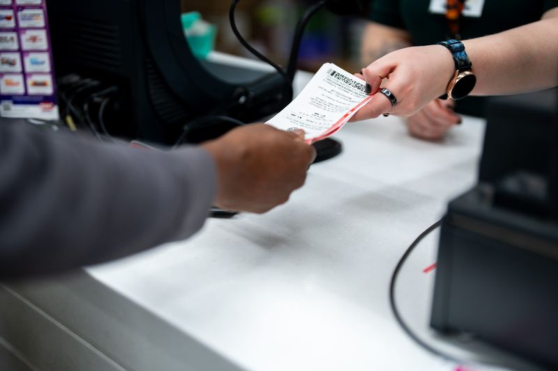 Lottery tickets are purchased by a customer Feb. 19, 2026, at Acme Fresh Market #1 in Akron, Ohio.