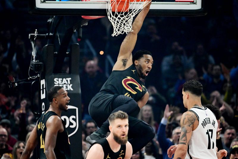 Cleveland Cavaliers guard Donovan Mitchell (45) reacts after a dunk against the Brooklyn Nets on Feb. 19, 2026, in Cleveland.