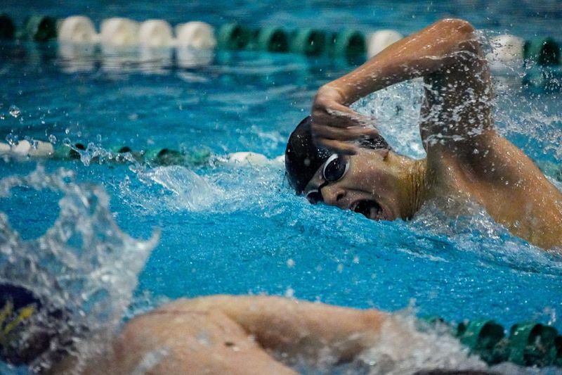Kent Roosevlt’s Sam Love competes in the 100 yard freestyle during OHSAA DII District Swimming Championships, Feb. 20, 2026, at the Robert F. Busbey Natatorium in Cleveland, Ohio.