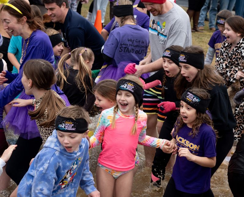 Elementary students, faculty and staff start off the Jackson Local Schools Foundation annual Polar Bear Plunge fundraiser for Jackson schools at Lake Cable on Feb. 21, 2026.