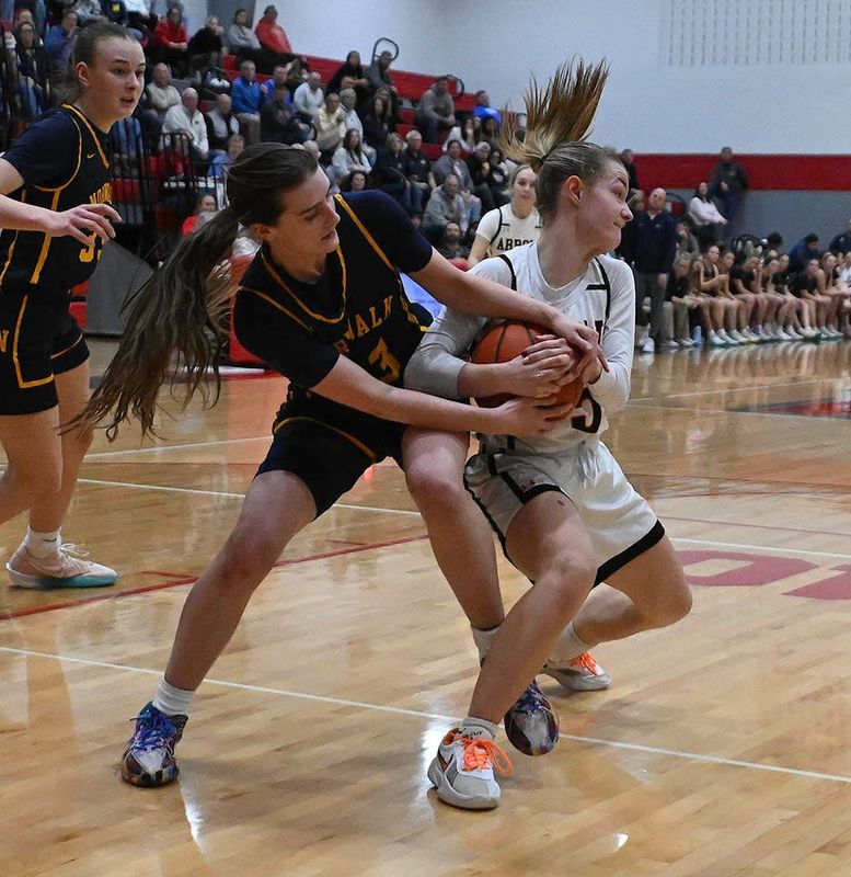 Ashland's Grace Tobias and Norwalk's Trinity Lazzara vie for possession.