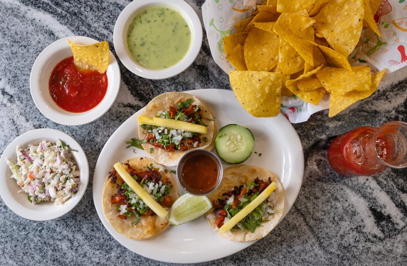 Al pastor tacos with chips and salsa at La Loma in Upper Arlington.