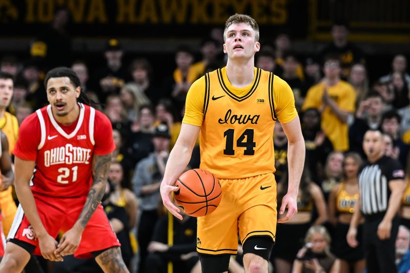 Iowa guard Bennett Stirtz reacts after being fouled by Ohio State forward Devin Royal (21) on Feb. 25.