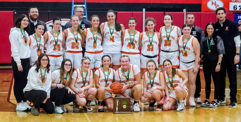 Strasburg High School's girls' basketball team is pictured with their district championship trophy. The Tigers defeated Caldwell 51-30 to win a Division 7 district championship on Saturday, Feb. 28, 2026 at New Philadelphia High School.