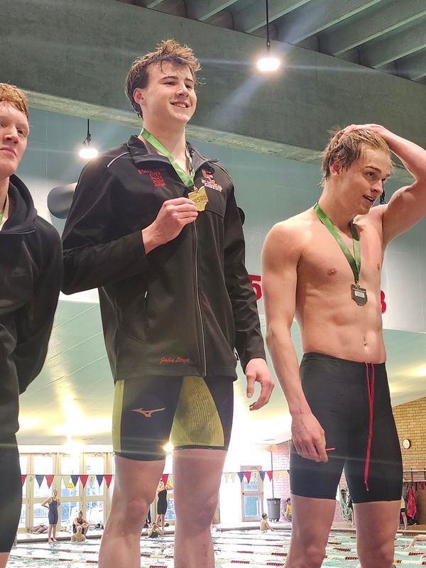St. Charles senior Jake Lloyd celebrates his 50 free state championship, which he earned in a state-record time of 19.39 seconds.