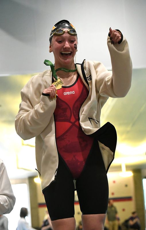 Upper Arlington's Kiera Powers shows off one of her Division I state championship medals.