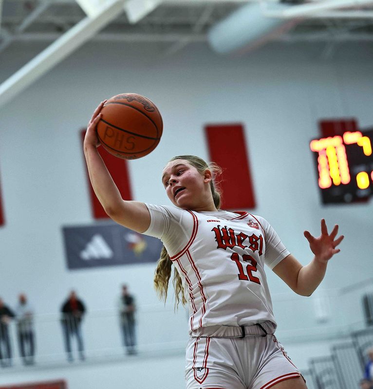 Lakota West's Isabella Saunders (12) grabs a rebound during their district final win over West Clermont Saturday, Feb. 28, 2026.