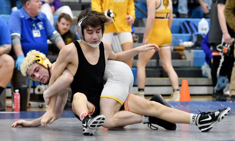 Waynedale’s Brock Beckler wrestles Dalton’s Ethan Houmard in the 120-pound championship match Saturdays at the Northwestern sectionals. Beckler defeated Houmard 15-0.