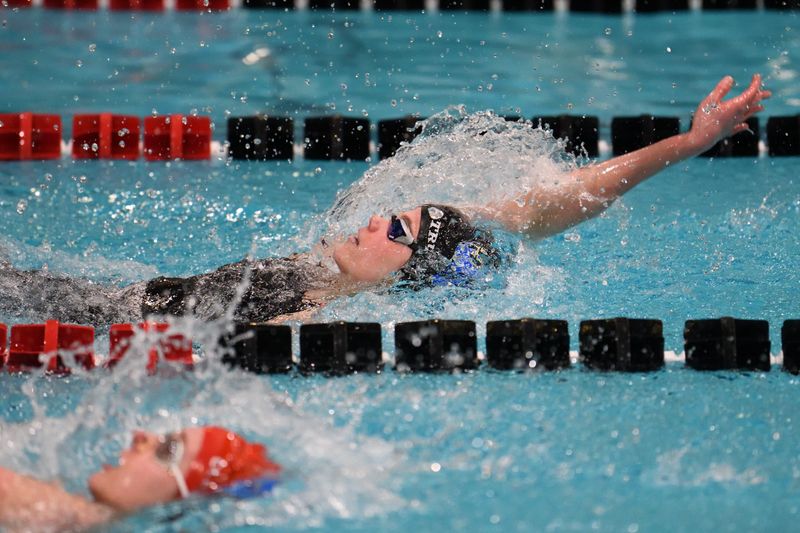 Ontario's Mirielle Trumpower swims the 100 backstroke at the Division II state meet at the C.T. Branin Natatorium.