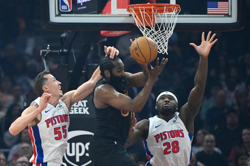 Mar 3, 2026; Cleveland, Ohio, USA; Detroit Pistons forward Duncan Robinson (55) and forward Isaiah Stewart (28) defend a pass by Cleveland Cavaliers guard James Harden (1) in the first quarter at Rocket Arena. Mandatory Credit: David Richard-Imagn Images