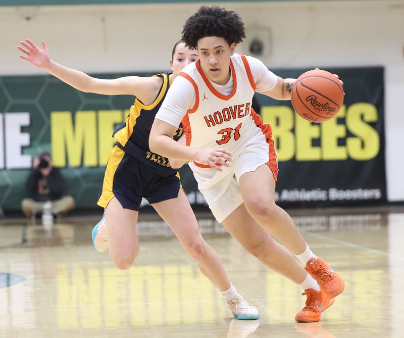 Hoover’s Zoe McCort brings the ball down court defended by Olmsted Falls' Reese Timura in an OHSAA regional semifinal, March 3, 2026, at Medina High School.