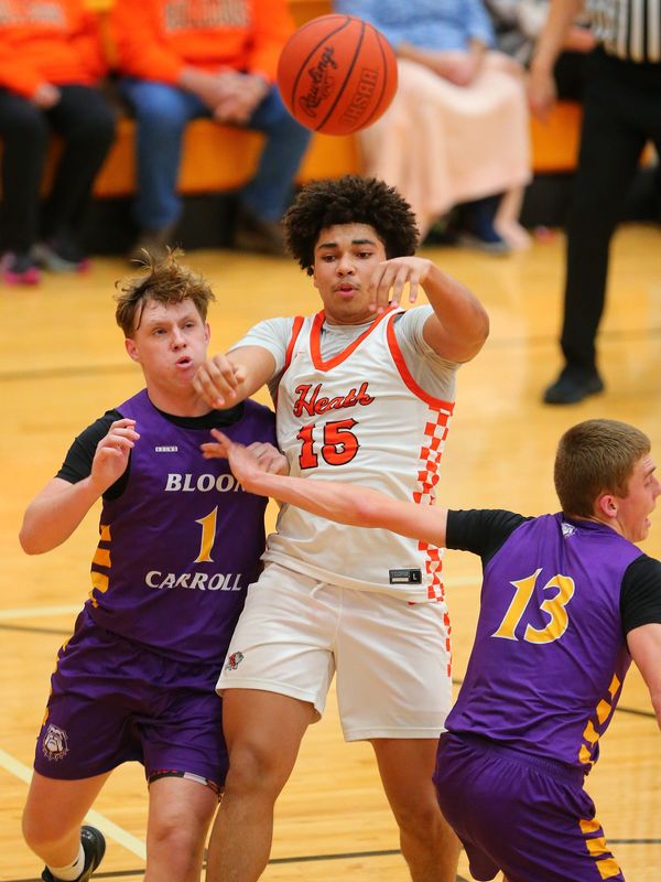 Heath's J.J. Holloway passes against Bloom-Carroll on March 3.