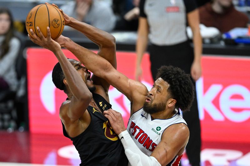 Cleveland Cavaliers center Evan Mobley (4) shoots beside Detroit Pistons guard Cade Cunningham (2) in the fourth quarter at Rocket Arena in Cleveland on Tuesday, March 3, 2026.