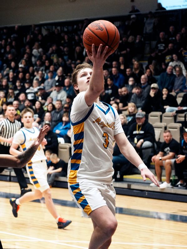 Gavin Ferguson drives in for a layup during Maysville's 78-32 win against East Liverpool in a Division IV East District semifinal on Tuesday, March 3, 2026, at the ECO Center in Belmont, Ohio. Maysville advanced to its fourth district final in four years.
