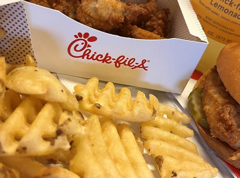 A Chick-fil-A chicken meal with nuggets, waffle fries and burger.