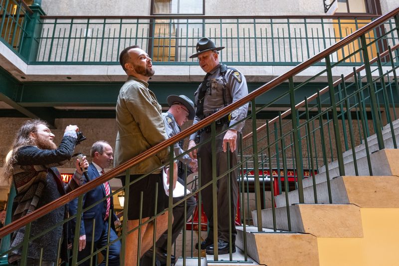 D.J. Byrnes, an online writer who goes by The Rooster, is blocked by a state trooper from following a lawmaker inside the Ohio Statehouse. Republican gubernatorial candidate Vivek Ramaswamy called Byrnes' reporting false and "nuts."