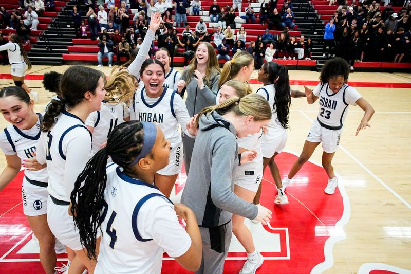 The Archbishop Hoban High School's girls varsity basketball team celebrates a win over Twinsburg in an OHSAA DII girls high school basketball regional final game, March 5, 2026, at Wadsworth High School in Wadsworth, Ohio.