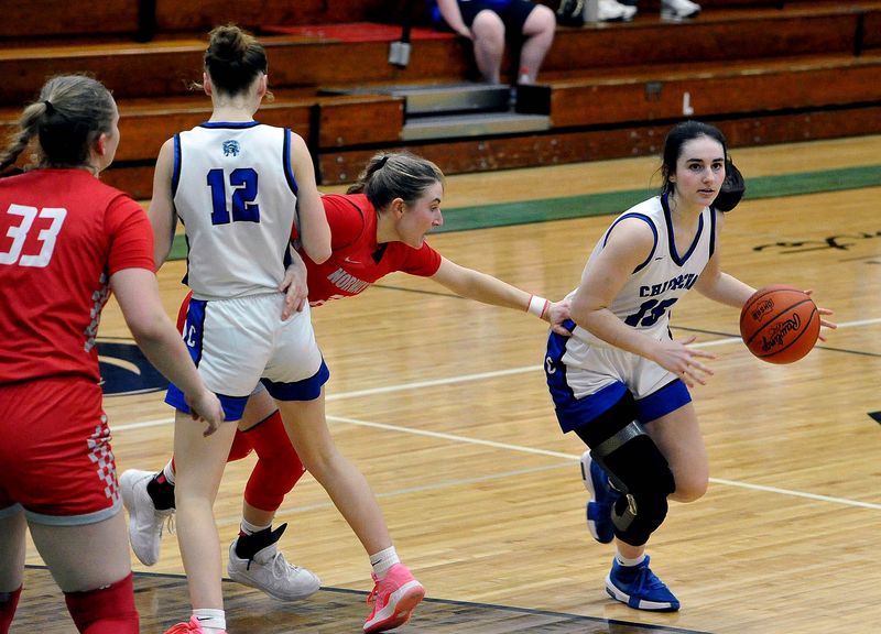 Chippewa Aira Regan leaves Norwayne Allie DeMassimo behind as she clears a pick by teammate Myra Lewis. The Chippewa Chips and the Norwayne Bobcats met in the division V girls basketball final at Elyria Catholic High School for a 7pm tipoff. Norwayne won the game with a 52 to 33 score and will move on to the state finals.