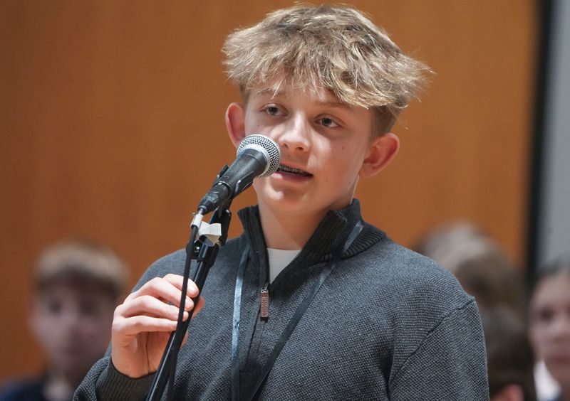 Tommy Schervish of St. Michael School spells a word at the Canton Repository’s 80th Regional Final Spelling Bee held at Kent State University Stark.