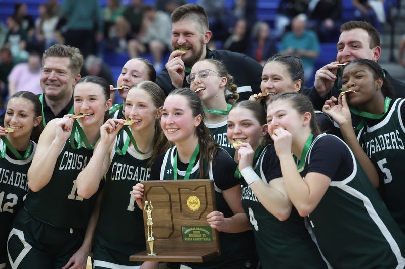 The Central Catholic girls basketball team celebrates after defeating Smithville to win a regional championship, Saturday, March 7, 2026, at Lake High School.