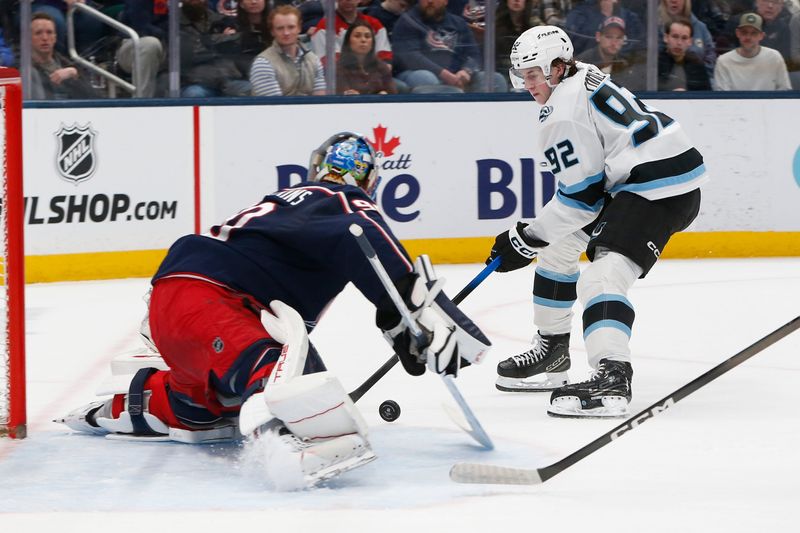 Mar 7, 2026; Columbus, Ohio, USA; Columbus Blue Jackets goalie Elvis Merzlikins (90) makes a save on the shot from Utah Mammoth center Logan Cooley (92) during the first period at Nationwide Arena. Mandatory Credit: Russell LaBounty-Imagn Images
