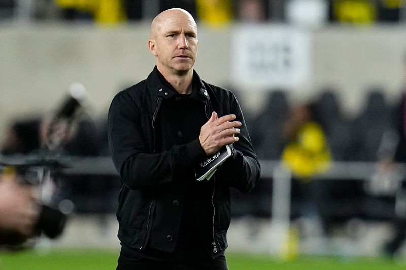 Columbus Crew manager Henrik Rydstrom salutes the fans after the final whistle during the MLS match against the Chicago Fire at ScottsMiracle-Gro Field in Columbus on March 7, 2026. The teams tied 0-0.