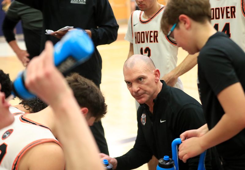 Hoover head coach Mike Bluey talks to his team just before the start of the fourth quarter against Riverside in a Division II district final, Saturday, March 7, 2026, at Valley Forge High School.