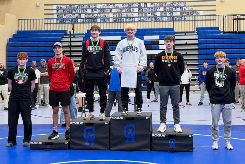 Cambridge junior Marshall Laishley stands on the podium after claiming the 150-pound Division II District Championship at Gallia Academy on Saturday, March 7, 2026. Laishley will now advance to the state tournament next weekend at the Schottenstein Center on the campus of Ohio State University.
