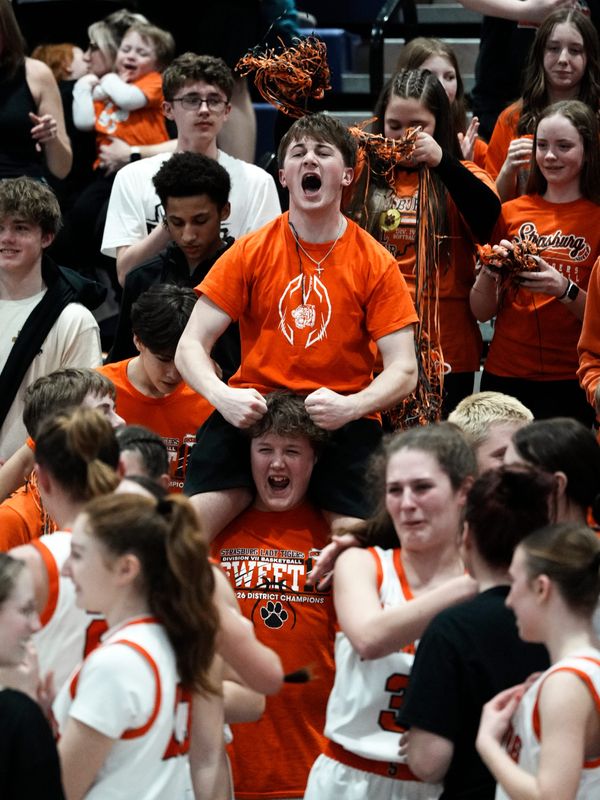 Strasburg students get excited following the girls basketball team's 50-33 win against Reedsville Eastern in a Division VII regional final on Saturday, March 7, 2026, at Jim Myers Gymnasium in Logan, Ohio. The win secured the school's first state tournament in girls basketball.
